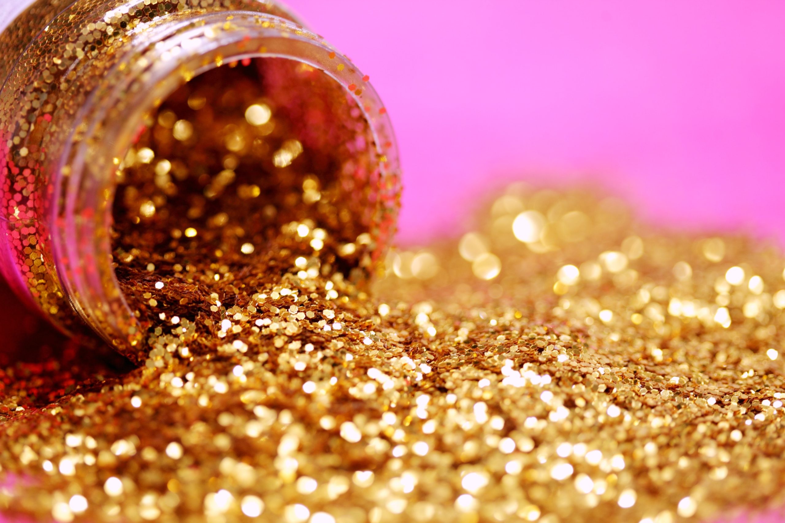 Golden Glitter Spilling Out of a Jar